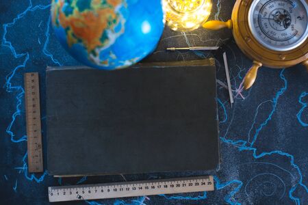 Still life globe on a black matte background with a barometerの写真素材