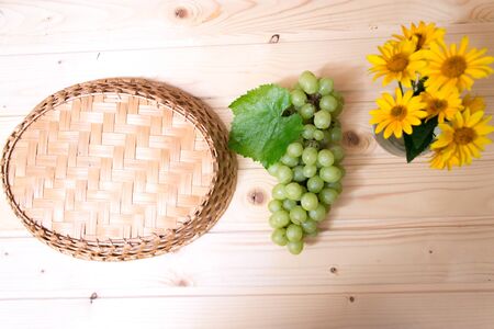 Grapes of grapes on a wooden tableの写真素材