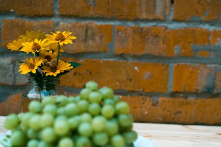 Grapes of grapes on a wooden tableの写真素材