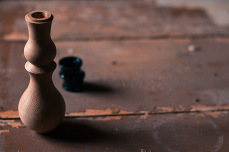 Wooden fragment ornament for shisha decoration on a wooden backgroundの写真素材