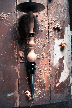 Wooden fragment ornament for shisha decoration on a wooden backgroundの写真素材