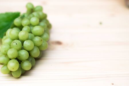 Grapes of grapes on a wooden table