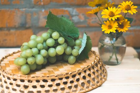 Grapes of grapes on a wooden tableの写真素材