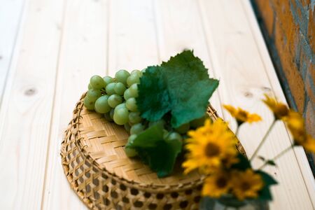 Grapes of grapes on a wooden tableの写真素材