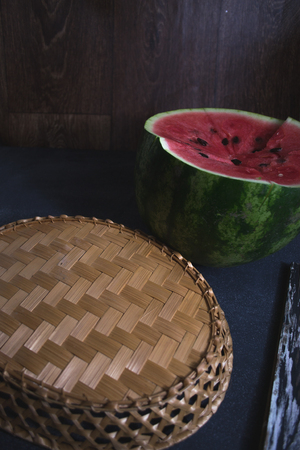 Sliced slices of watermelon on a dark backgroundの写真素材