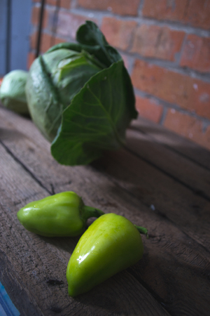 Fresh cabbage heads on a wooden backgroundの写真素材