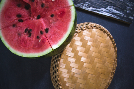 Sliced slices of watermelon on a dark backgroundの写真素材