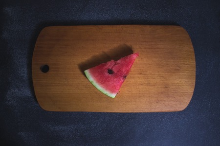 Sliced slices of watermelon on a dark backgroundの写真素材