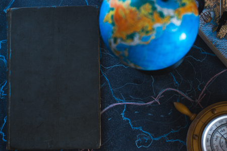 Still life globe on a black matte background with a barometerの写真素材