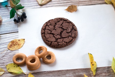 Bagels on a sheet of paper on a wooden backgroundの写真素材