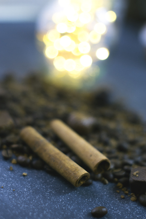 Sweet still life. Coffee beans, chocolate bars and cinnamon sticksの写真素材