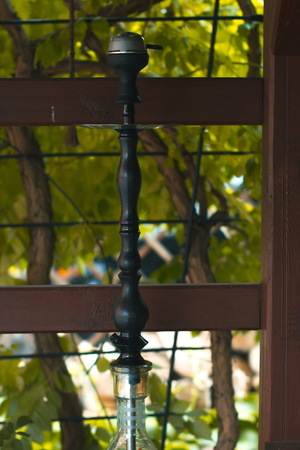 Hookah on a summer terrace with a blurred background