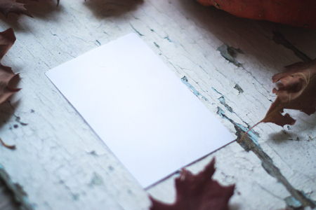 White sheet of mocap paper on a wooden backgroundの写真素材