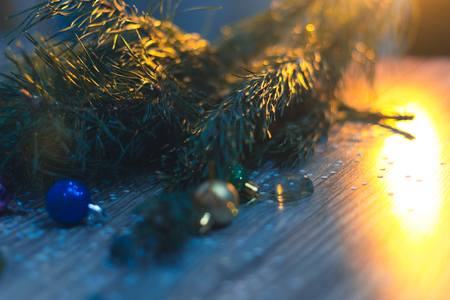 Christmas decorations on a wooden background with Christmas treesの写真素材