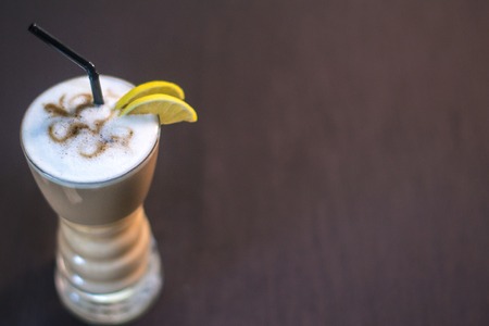 Coffee in a glass cup in a cafe with a blurred backgroundの写真素材