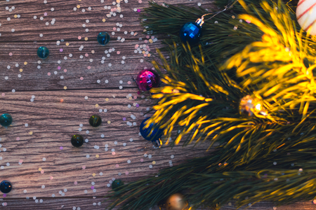 Christmas decorations on a wooden background with Christmas treesの写真素材