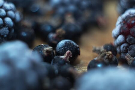Macro of a blackberry on a wooden background