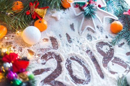 New Year's still-life. On a wooden background in the snowの写真素材