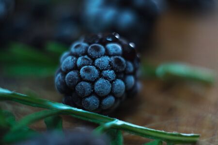 Macro of a blackberry on a wooden backgroundの写真素材