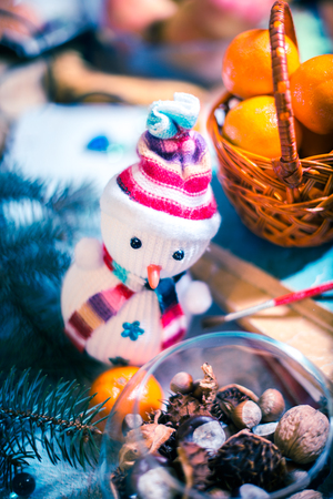 Soft snowman on a pile of books. New Year's conceptの写真素材