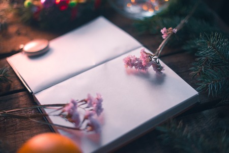 New Year's background. Notepad on wooden boards with decorationsの写真素材