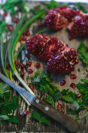 Garnet on a dark wooden old background. Still lifeの写真素材