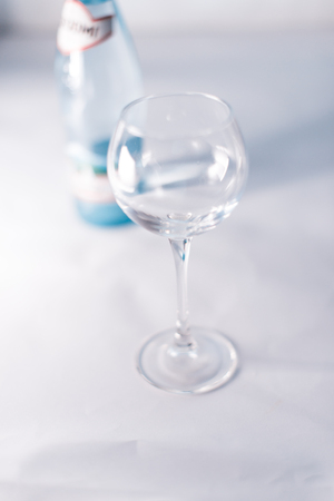 Bottle of Borjomi on a white blurred backgroundの写真素材