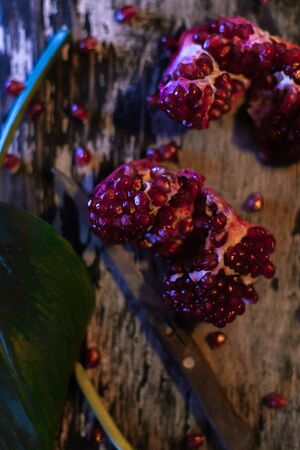 Garnet on a dark wooden old background. Still lifeの写真素材