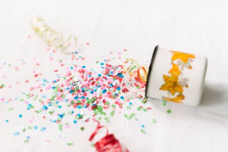 White mug with confetti isolate festive mocap.の写真素材