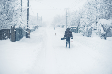 Winter snowfall in the village. Snowy collapse.の写真素材