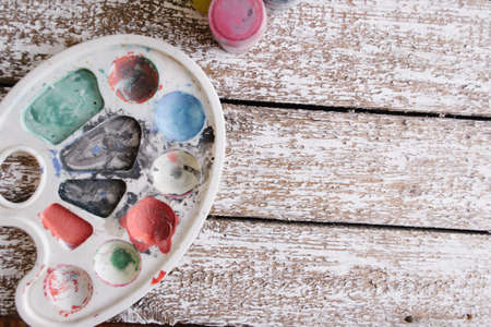 Paint on an old white wooden backgroundの写真素材