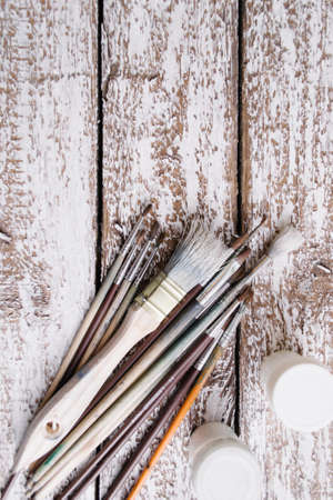 Brushes on a wooden painted white backgroundの写真素材