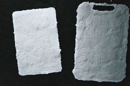 Kitchen cement boards on a black background.の写真素材