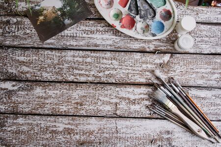 Brushes on a wooden painted white backgroundの写真素材
