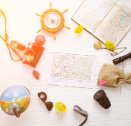Traveler accessories still life on a white wooden background.の写真素材