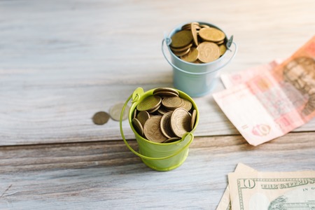 American dollars and Ukrainian hryvnia on a white background isolates.の写真素材