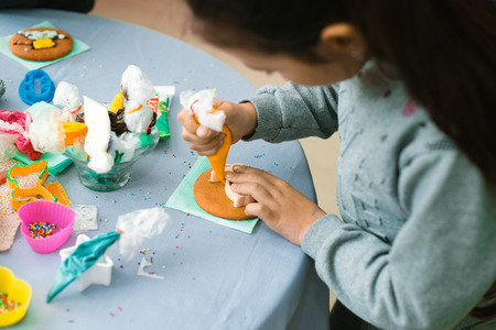 Children make sweets, make drawings with cream.の写真素材