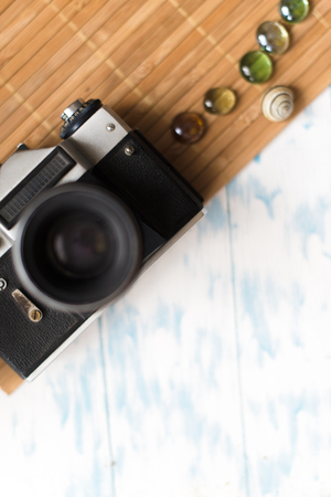 Old retro camera on vintage wooden backgroundの写真素材