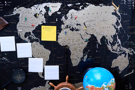 Black political map of the world. Still life of a traveler.