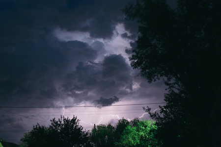 Night summer thunderstorm in the countryside. Night landscape.の写真素材