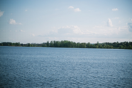 Spring evening sunny landscape near the river.の写真素材