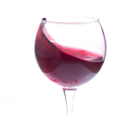 A glass with red wine on a white background. Isolate.の写真素材