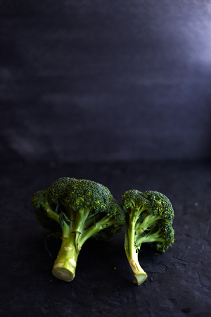 Fresh brocoli on a black matte background.の写真素材