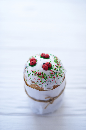 Easter cake on a white wooden background.の写真素材