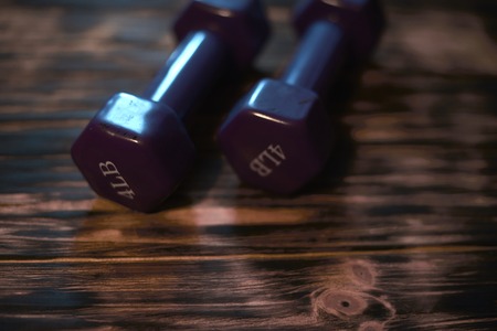 Dumbbells on a dark wooden background. Concept CrossFit.の写真素材
