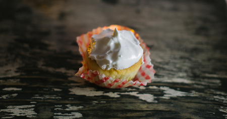 Cupcakes on a wooden background in the sunlight.の写真素材