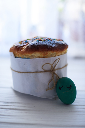 Easter cake on a white wooden background.