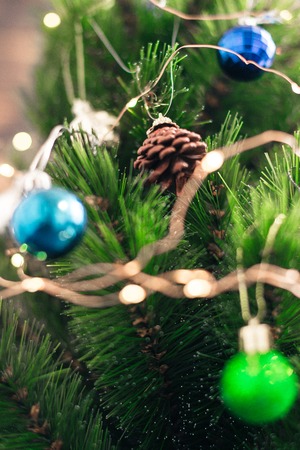 Christmas decorations on the tree with blurred background.の写真素材
