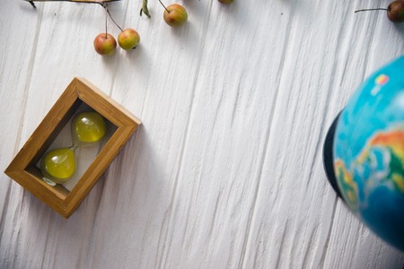 Globe on wooden white boards. Flat lay.の写真素材