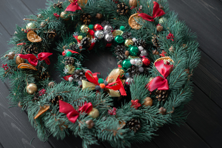 Natural Christmas wreath on black wooden background.の写真素材